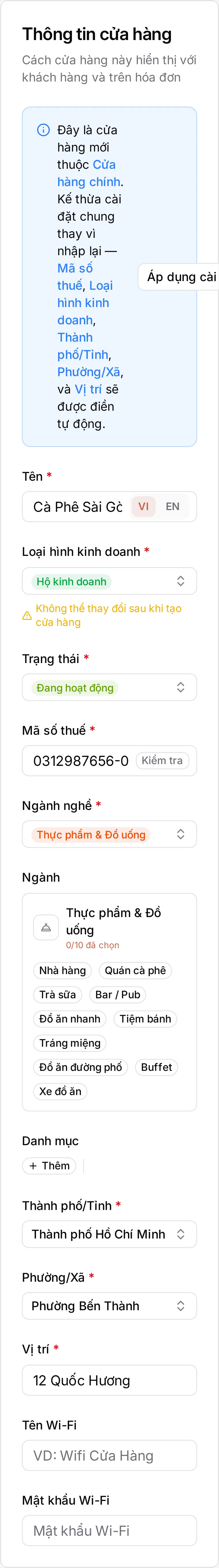 Thẻ Thông tin cửa hàng đã điền xong cho chi nhánh: Tên Cà Phê Sài Gòn Thảo Điền, Mã số thuế 0312987656-001, Trạng thái Đang hoạt động, Loại hình kinh doanh Hộ kinh doanh kèm ghi chú không đổi được sau khi tạo, Ngành nghề Thực phẩm & Đồ uống, Thành phố/Tỉnh Thành phố Hồ Chí Minh, Phường/Xã Phường Bến Thành và Vị trí 12 Quốc Hương. Khung xanh Áp dụng cài đặt cửa hàng vẫn nằm phía trên các ô